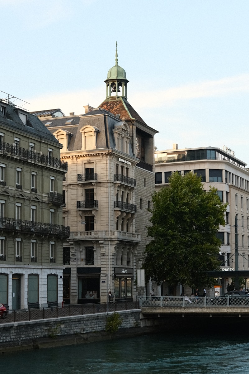 A river running through a city next to tall buildings